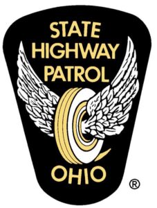 Logo for Ohio State Patrol, which features a gold and white tire with wings on both sides
